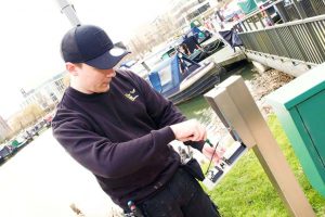 A person from Bee Tee Alarms fitting an alarm In Coventry